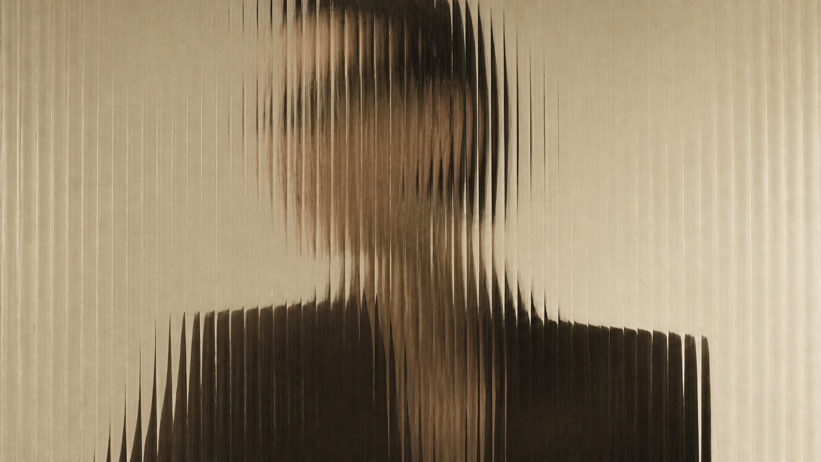 Abstract human silhouette refracted through fluted glass